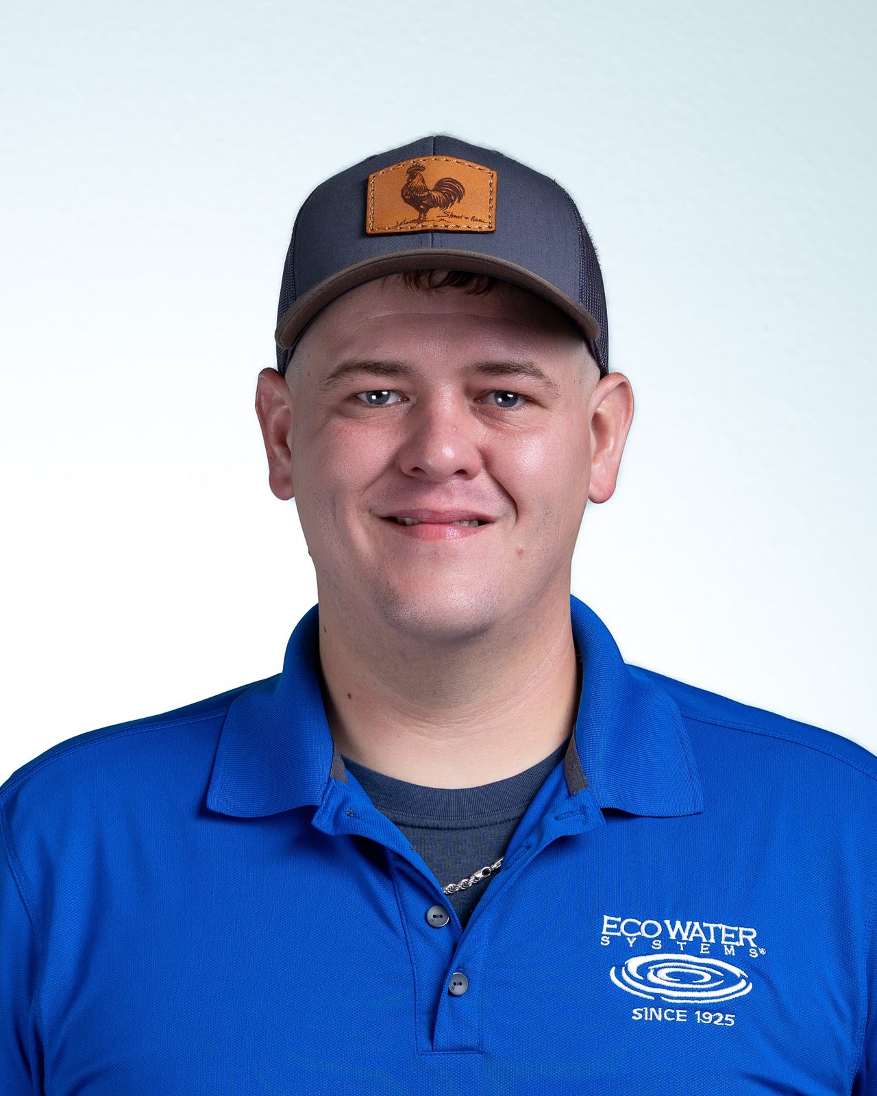 Headshot of person in blue Eco Water Systems polo shirt
