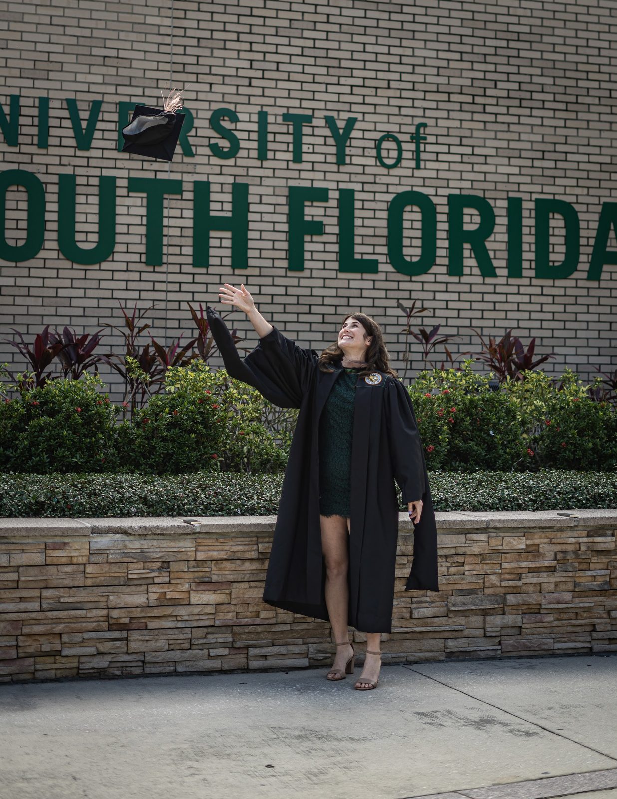 Graduate tossing cap at University of South Florida