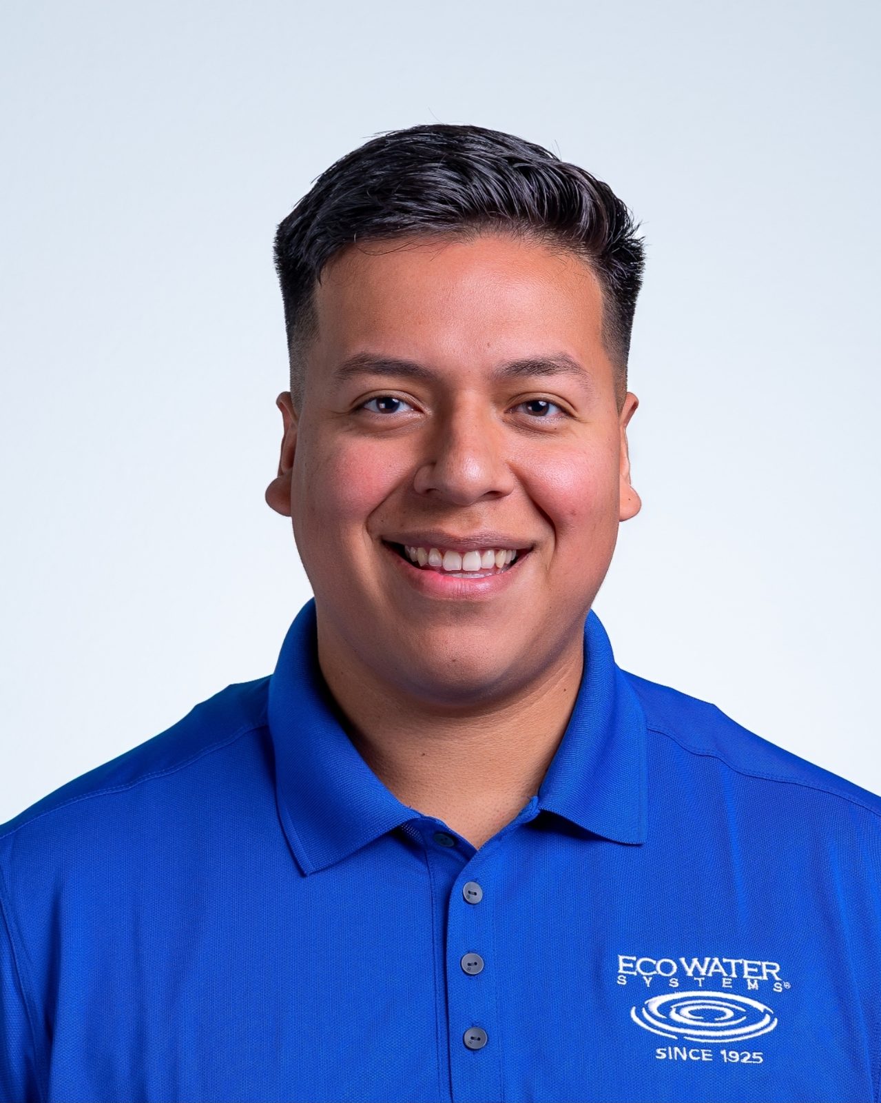 Headshot of person in blue Eco Water Systems polo shirt